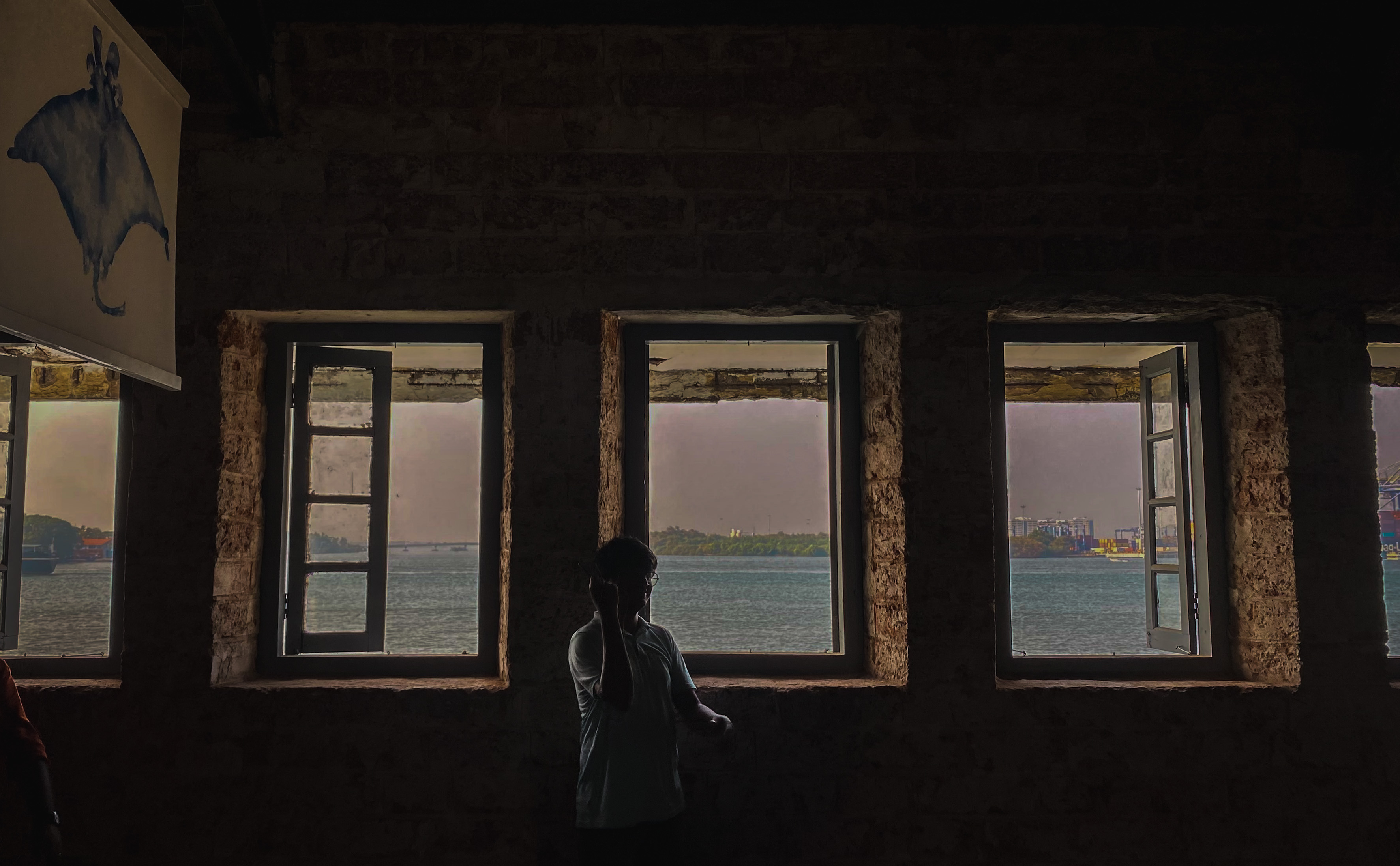 A window framing a view of the sea